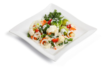 Salad with vegetables, on a white