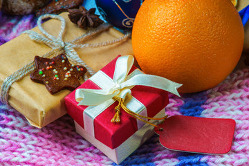 Christmas gift boxes, orange, cookie and winter scarf