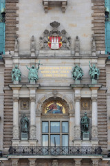 The part of facade of the Hamburg City Hall (Rathaus). The coat of arms of Hamburg and figures of...