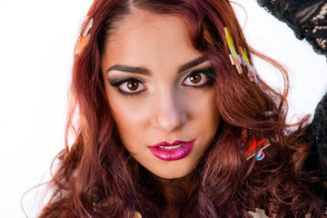 Beautiful fashion model girl close-up with puzzle in her hair