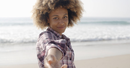 Happy Woman Giving Hand On Beach