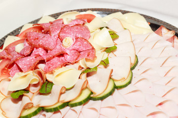 Food tray with chees, eggs, ham, sausage and vegetable