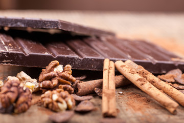 Delicious chocolates and cocoa powder,close up