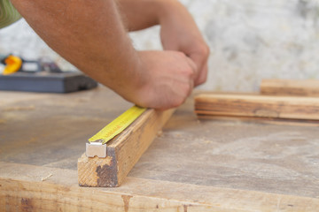 Carpenter working hard in his small 