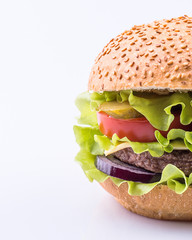 Big burger with beef cutlet and fresh vegetables isolated on white background