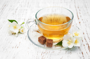 Cup of tea with jasmine flowers