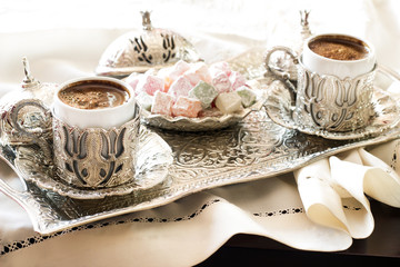 Turkish coffee with delight and traditional silver serving set