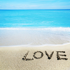 Love inscribed in the sand of a beach