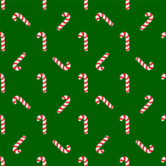 Christmas candies on green background.