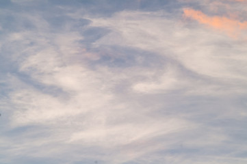 Obraz premium Autumn red gray clouds in the blue sky