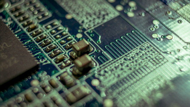 4K close up macro computer motherboard circuits surface rotating dolly