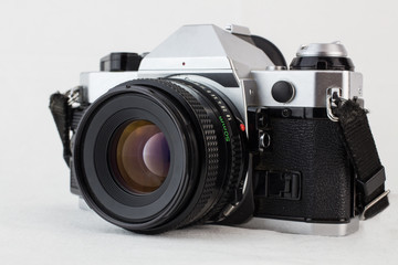 Retro vintage camera on a white background with selective focus