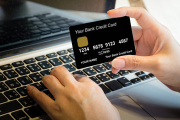 Hand Holding Credit Card Over Laptop Online Shopping Concept