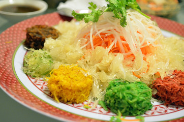 A special dish during Chinese New Year called Yusheng or Yee Sang..