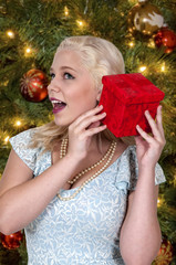 Beautiful Woman Shaking Gift