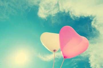 vintage heart balloon on blue sky concept of love in summer and valentine, wedding honeymoon