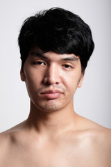 Fototapeta na wymiar Headshot of Asian man face with no makeup