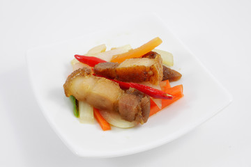 The Thai stir fried crispy pork on the mini white dish.