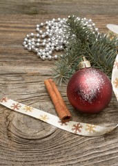 Christmas decoration with cinnamon on wooden background