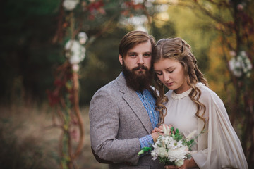 Fototapeta premium beard man and nice woman in the wood