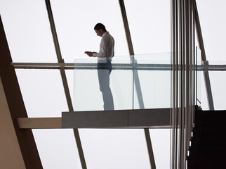 young successful business man in penthouse apartment working on