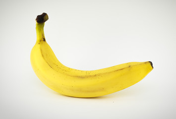 Single banana against white background