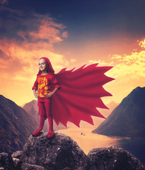 Super hero girl in mountains