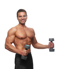Muscular guy doing exercises with pair of dumbells.