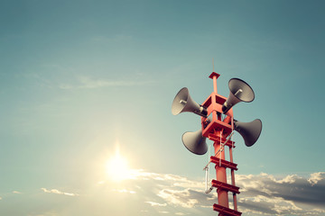 Horn speaker for public relations sign symbol, vintage color - sun with blue sky - obrazy, fototapety, plakaty