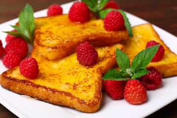 delicious French toast with raspberries and honey