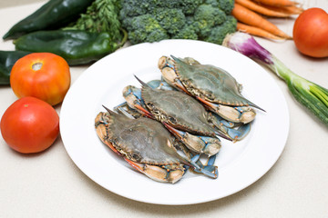 Raw blue crab with vegetables