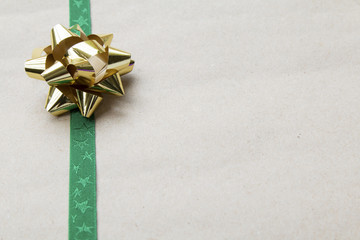 Gift Wrapped Bow and Ribbon on Recycled Paper