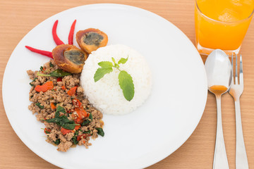 Stir fried basil with pork and black preserved egg