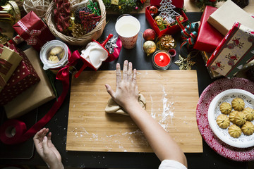 Overhead shot of Christmas presents and wrapping papers