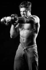 Fototapeta na wymiar Sexy muscular fitness man. Black and white image.