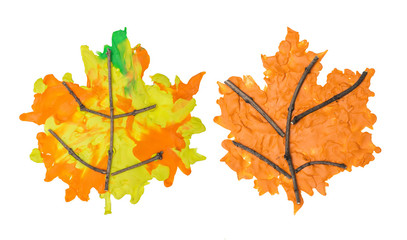 Set of autumn maple leafs made from plasticine and branches on white background