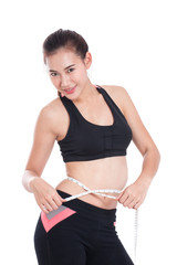 Fitness young woman taking measurements of her body. healthy concept
