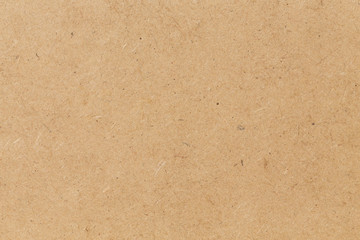Pressed beige chipboard texture.