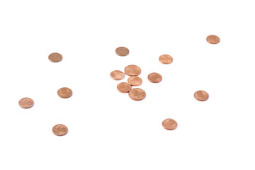 Scattered coins on white table