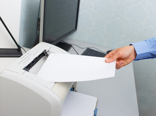 Businessman working with printer