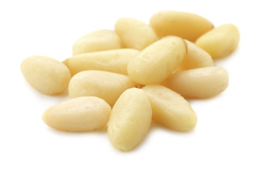 Fototapeta na wymiar Pine nuts on white