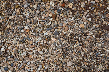 Crushed granite and pebble gravel texture with earth tone colorful