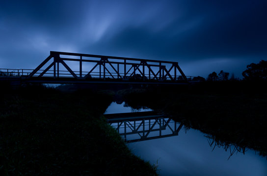Fototapeta Railway steel truss bridge in Poland, over small river 