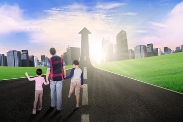 Fototapeta premium Kids and dad walking on the road with upward arrow