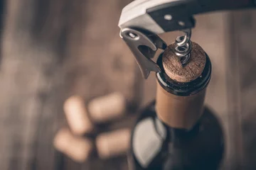  Corkscrew and bottle of wine on the board © poplasen