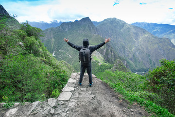 Tourist looking over Machu Picchu, Peru