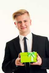 young blond man with green gift