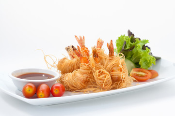 Tiger prawns baked with crispy noodles isolated on white