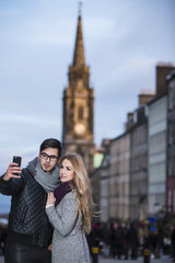 Attractive young couple making selfie