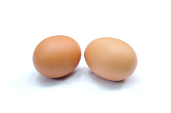 two brown chicken eggs isolated set horizontal on white background